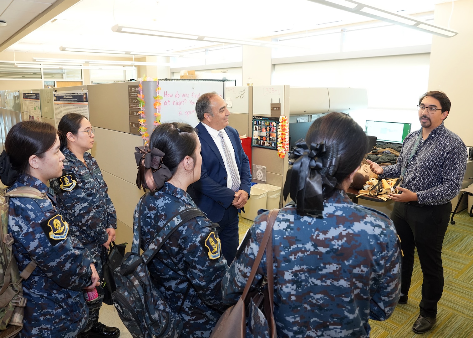 JOINT BASE SAN ANTONIO-FORT SAM HOUSTON – (Aug. 14, 2025) – Andres Martinez-Murillo (right), a principal investigator assigned to Naval Medical Research Unit (NAMRU) San Antonio’s Combat Casualty Care and Operational Medicine directorate, joined by Chief Science Director Dr. Darrin Frye, speaks with flight nurses from the Royal Thai Air Force about cold weather medical research at the Battlefield Health and Trauma Research Institute. The nurses visited medical commands within Joint Base San Antonio to enhance their nursing knowledge and skills to include advancing quality of nursing practice related to disease management. Navy Medicine Research & Development (NMR&D) contributes directly to positive working relationships with partner nation militaries, keeping the scope of Department of Defense capabilities wide, and at the ready, to address emerging threats aboard. NAMRU San Antonio, part of NMR&D, conducts gap-driven combat casualty care, craniofacial, and directed energy research in support of Navy, Marine Corps and joint U.S. warfighter health readiness and lethality while engaged in routine and expeditionary operations. (U.S. Navy photo by Burrell Parmer, NAMRU San Antonio Public Affairs/Released)