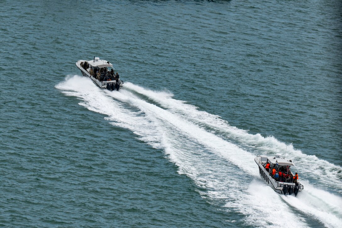 U.S. and Panamanian special forces members depart a bay after a simulated visit, board, search, and seizure training during PANAMAX-Alpha Phase I, at Panama City, Panama, July 16, 2025. Joint Task Force-Bravo’s UH-60 Blackhawk, assigned to the 1-228th Aviation Regiment, provided overhead support during a bilateral simulated visit, board, search, and seizure training between U.S. and Panamanian special forces units. (U.S. Air Force photo by Staff Sgt. Sadie Colbert)