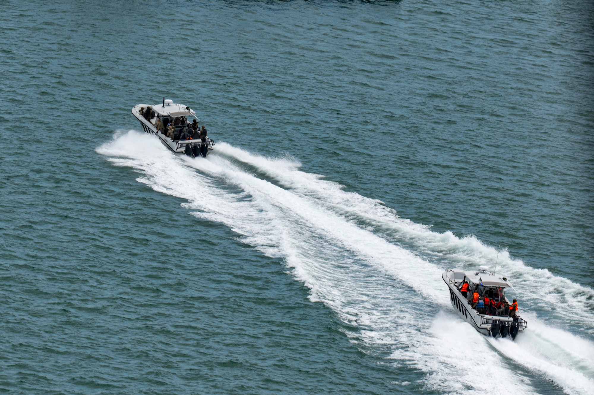 U.S. and Panamanian special forces members depart a bay after a simulated visit, board, search, and seizure training during PANAMAX-Alpha Phase I, at Panama City, Panama, July 16, 2025. Joint Task Force-Bravo’s UH-60 Blackhawk, assigned to the 1-228th Aviation Regiment, provided overhead support during a bilateral simulated visit, board, search, and seizure training between U.S. and Panamanian special forces units. (U.S. Air Force photo by Staff Sgt. Sadie Colbert)