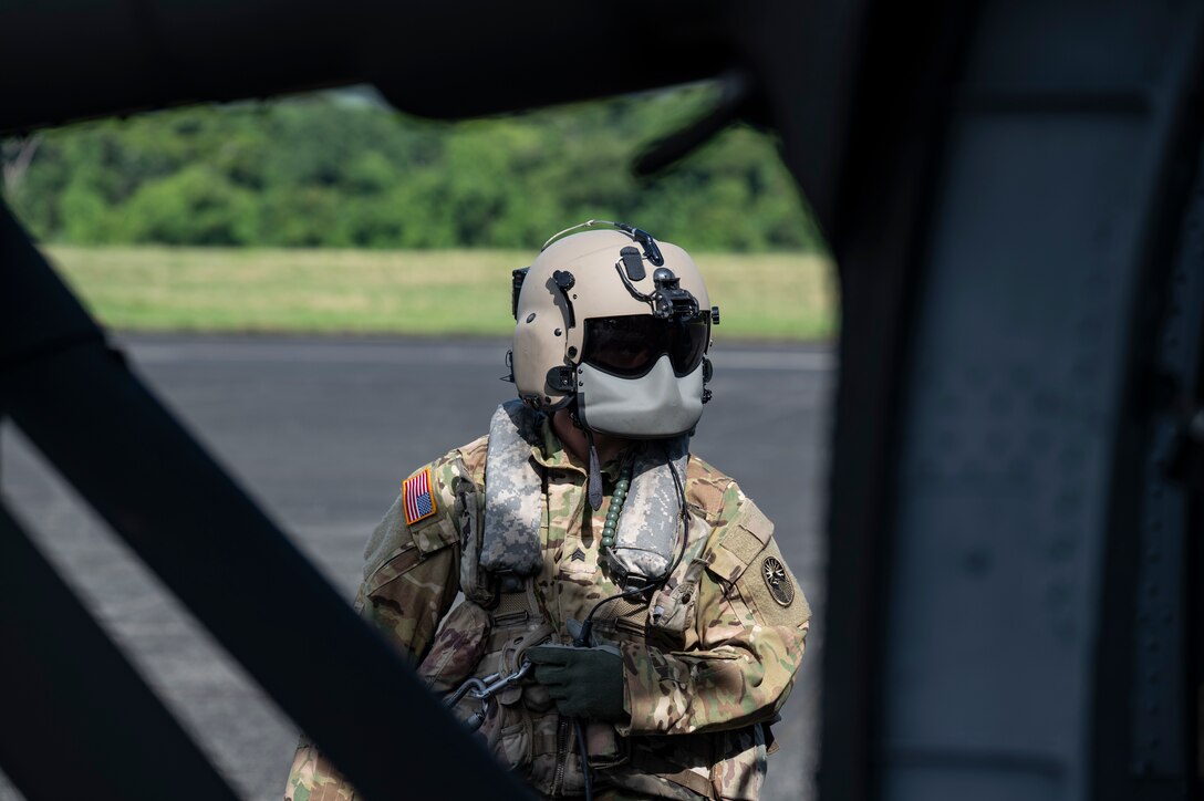 U.S. Army Sgt. Chris Schreerer, 1st Battalion, 228th Aviation Regiment crew chief, conducts a pre-flight check during PANAMAX-Alpha Phase I, at Panama Pacifico International Airport, Panama, July 16, 2025. PANAMAX is a joint exercise designed to enhance interoperability among participating nations and strengthen their ability to conduct multinational operations, particularly to defend the Panama Canal. (U.S. Air Force photo by Staff Sgt. Sadie Colbert)