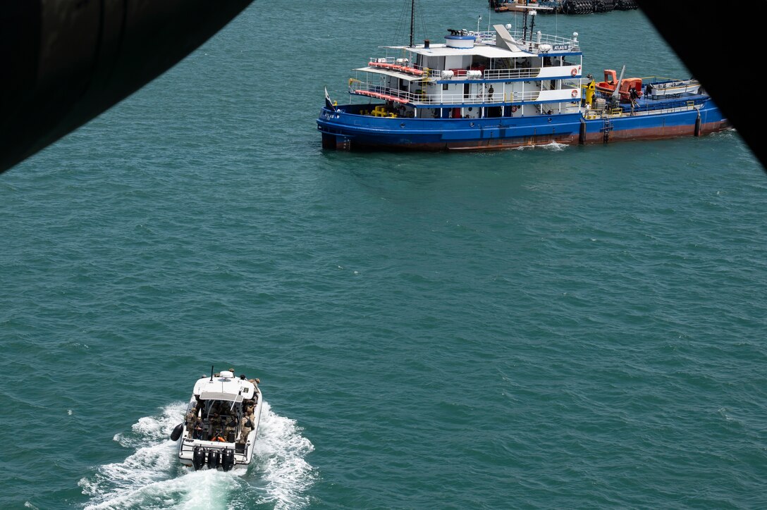 Panamanian Servicio Nacional Aeronaval service members approach a vessel for a simulated visit, board, search, and seizure training during PANAMAX-Alpha Phase I, at Panama City, Panama, July 16, 2025. PANAMAX is a joint exercise designed to enhance interoperability among participating nations and strengthen their ability to conduct multinational operations, particularly to defend the Panama Canal. (U.S. Air Force photo by Staff Sgt. Sadie Colbert)