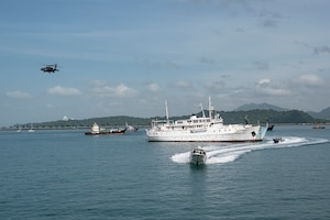 A UH-60 Blackhawk, assigned to the 1-228th Aviation Regiment out of Soto Cano Air Base, provides overhead support during a bilateral simulated visit, board, search, and seizure training between U.S. and Panamanian special forces units, at Panama City, Panama, July 17, 2025. PANAMAX is a joint exercise designed to enhance interoperability among participating nations and strengthen their ability to conduct multinational operations, particularly to defend the Panama Canal. (U.S. Air Force photo by Staff Sgt. Sadie Colbert)