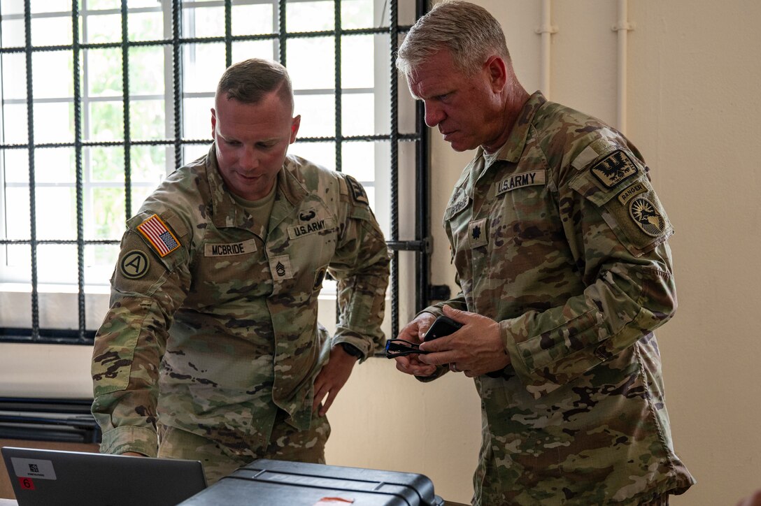 U.S. Army Sgt. 1st Class Christopher McBride, left, Joint Task Force-Bravo J3 operations non-commissioned officer in charge, and Lt. Col. Matthew George, Army Forces Battalion commander, conducts an operations check during AGILE BEAR 25, at Belize City, Belize, July 31, 2025. Exercises like AGILE BEAR increase our shared readiness to respond to natural disasters and security challenges through multifaceted capabilities ensuring our strength through unity and solidifying U.S. Southern Command’s, JTF-Bravo, as the partner of choice in Central America. (U.S. Air Force photo by Staff Sgt. Sadie Colbert)
