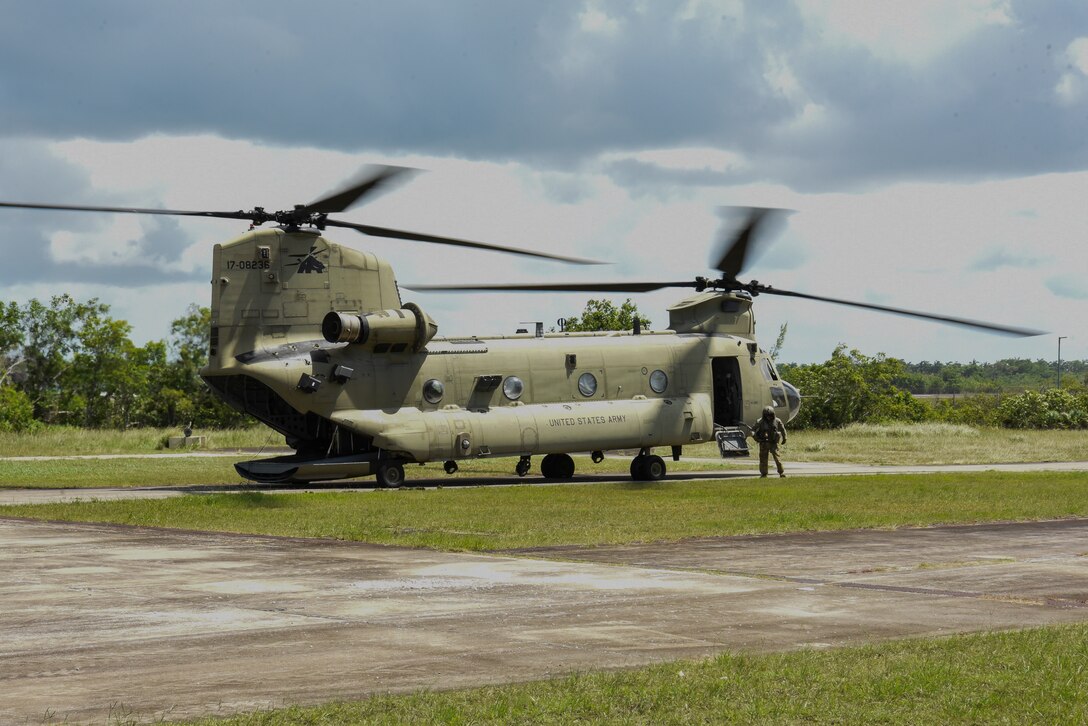 A CH-47 Chinook assigned to the 1st Battalion, 228th Aviation Regiment, out of Joint Task Force-Bravo, Soto Cano Air Base, Honduras, lands in Belize City, Belize, July 31, 2025, to participate in AGILE BEAR 25. AGILE BEAR provides U.S. Southern Command’s Situational Assessment Team with training focused on natural disaster response in Belize. This training includes deploying to the region, establishing a command and control center, and ensuring its communications are synchronized swiftly, which is critical in times of crises. (U.S. Air Force photo by Tech. Sgt. Dylan Rossitto)