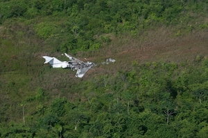 A crashed aircraft used for illicit activities was spotted in an illegal airstrip in Belize, August 2, 2025. As part of exercise AGILE BEAR 25, Joint Task Force-Bravo honed their Automated Route Reconnaissance Kit (ARRK) skills, which collected data on illegal landing strips in Belize. Exercises like AGILE BEAR increase our shared readiness to respond to natural disasters and security challenges through multifaceted capabilities ensuring our strength through unity and solidifying U.S. Southern Command's Joint Task Force-Bravo, as the partner of choice in Central America. (U.S. Air Force photo by Staff Sgt. Sadie Colbert)