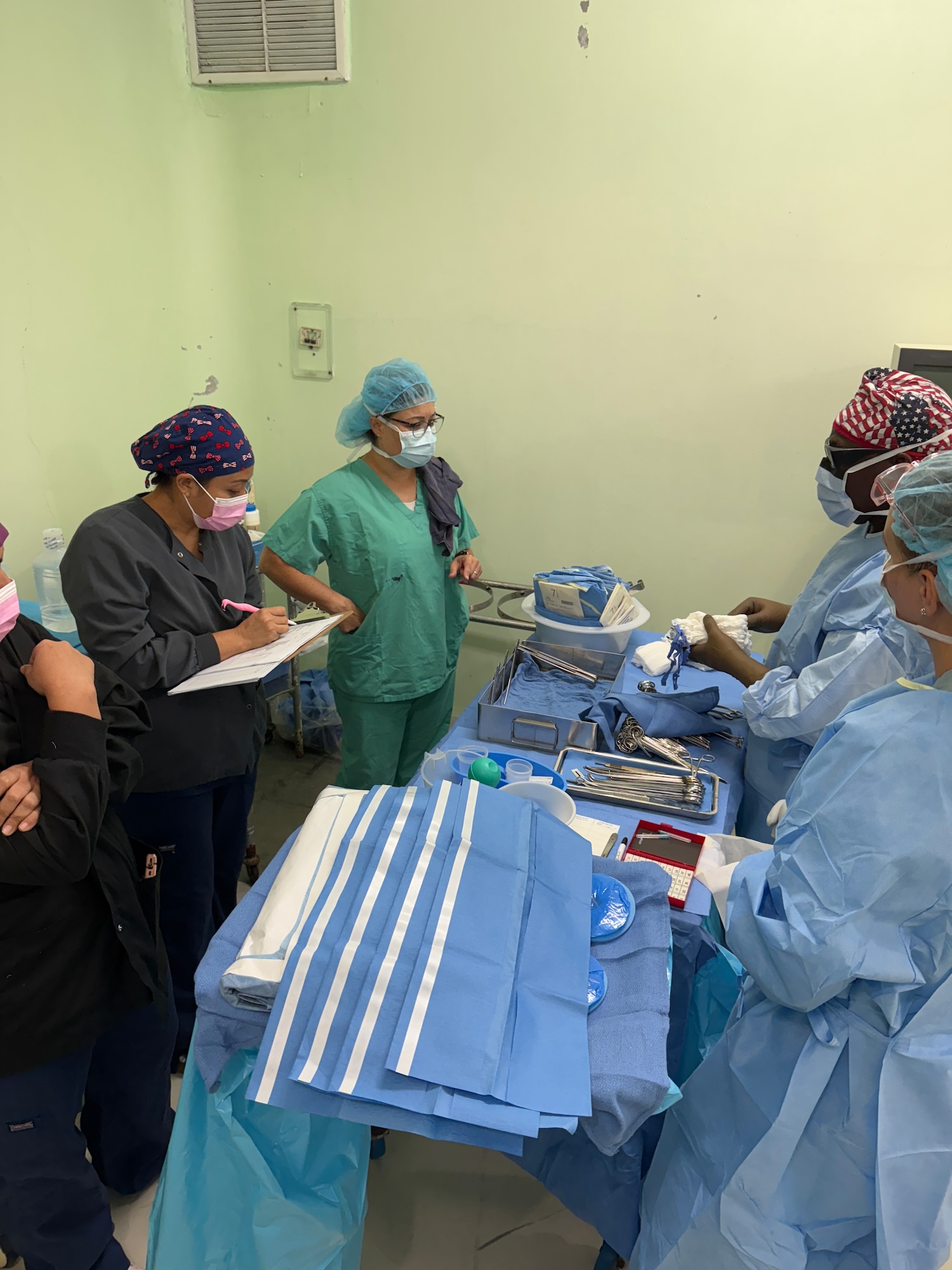 Nurses from Joint Task Force-Bravo and the Western Regional Hospital Belize, organize surgical instruments in preparation to conduct gallbladder and hernia surgical procedures during a JTF-Bravo surgical mission, Belmopan, Belize, Aug. 5, 2025. Surgical missions provide an opportunity for servicemembers to engage with the local community and give back to our neighbors while providing them with services that may otherwise be unavailable or in high demand. Since 1992, medical support to Central America has been a hallmark of JTF-Bravo’s presence in the region, improving overall health and long-term stability.  (U.S. Air Force photo by Senior Airman Aaliyah Waalee)