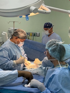Belize surgeon, Dr. Zul, prepares to make his first incision along with Joint Task Force-Bravo members assisting in the gallbladder surgery, during a JTF-Bravo surgical mission, Belmopan, Belize, Aug. 5, 2025.Surgical missions provide an opportunity for servicemembers to engage with the local community and give back to our neighbors while providing them with services that may otherwise be unavailable or in high demand. Since 1992, medical support to Central America has been a hallmark of JTF-Bravo’s presence in the region, improving overall health and long-term stability. (U.S. Air Force photo by Senior Airman Aaliyah Waalee)