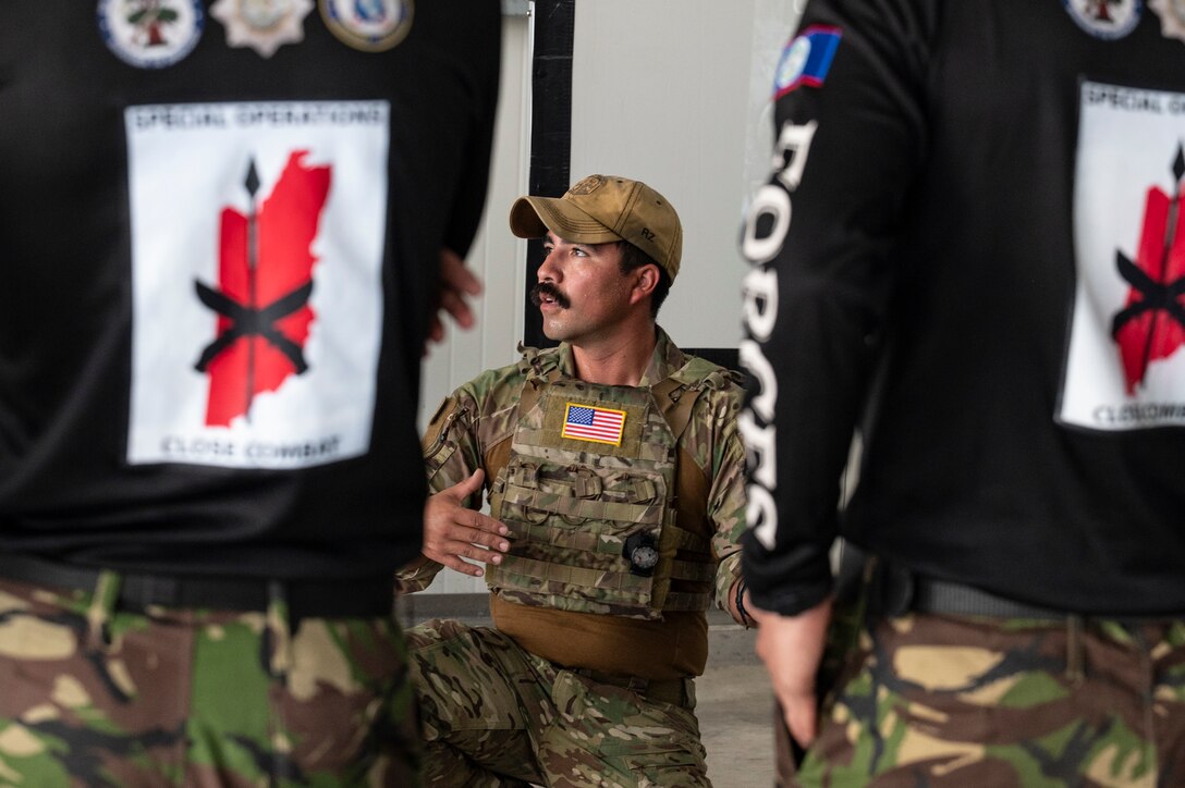 U.S. Air Force Tech. Sgt. Daniel Rodriguez, 100th Operation Support Squadron survival, resistance, evasion and escape instructor out of Mildenhall Air Force Base, England, walks through components of a combat medical kit during exercise AGILE BEAR 25, Belize City, Belize, Aug. 4, 2025. Exercises like AGILE BEAR, led by Joint Task Force-Bravo increase our shared readiness to respond to natural disasters and security challenges through multifaceted capabilities ensuring our strength through unity and solidifying U.S. Southern Command's JTF-Bravo, as the partner of choice in Central America. (U.S. Air Force photo by Staff Sgt. Sadie Colbert)