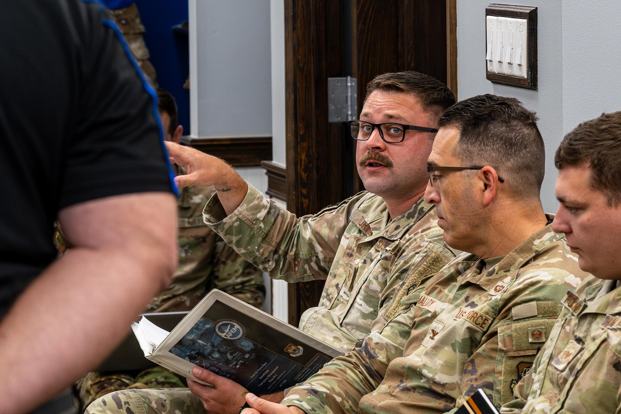 Airman speaks during tabletop exercise