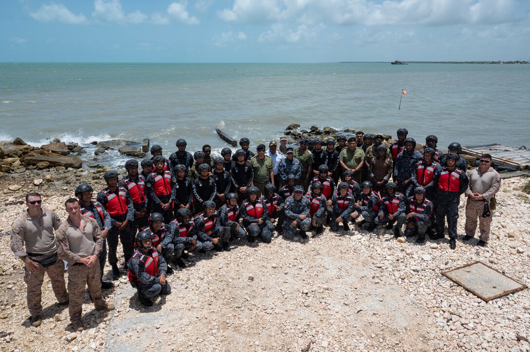 U.S., Belize Defence Force and Belize Coast Guard members pose for a group photo during AGILE BEAR 25, Aug. 6, 2025. The exercise aims to strengthen the readiness of U.S. and partner nation forces to respond effectively during a disaster and in countering transnational criminal organizations through various events. Key participants included Joint Task Force-Bravo, Belize Coast Guard, Belize Defence Force, U.S. Embassy-Belize, and the British Army Training Support Unit-Belize (BATSUB). (U.S. Air Force photo by Staff Sgt. Sadie Colbert)