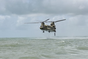 A Belize Defence Force member helocasts out of a CH-47 Chinook during AGILE BEAR 25, at Belize City, Belize, Aug. 6, 2025. As U.S. Southern Command’s rapid response element in Central America, Joint Task Force-Bravo provides a unique and essential capability in enabling our partner nations to proactively confront threats to their security through exercises like AGILE BEAR,  preparing our teams to respond to crises in the joint operational area. (U.S. Air Force photo by Tech. Sgt. Dylan Rossitto)