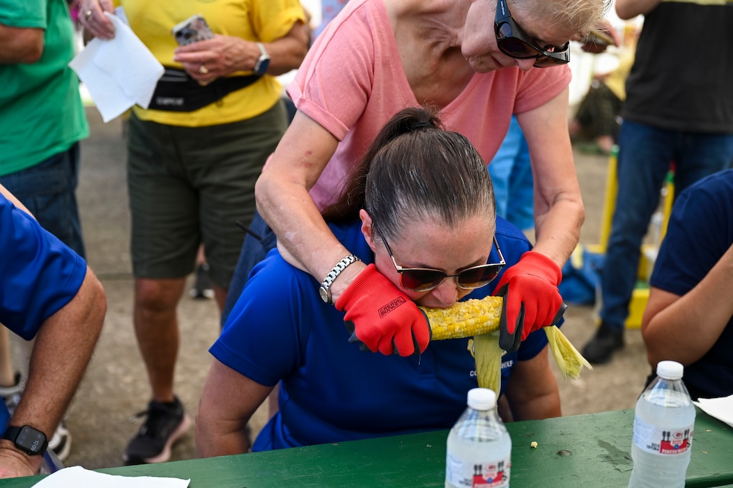 Chief Master Sgt. Tessa Fontaine, 88th Air Base Wing command chief, competes in a corn eating contest.
