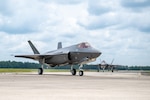 The first F-35A Lightning II aircraft permanently assigned to the Florida Air National Guard's 125th Fighter Wing taxi on the flight line after landing at Jacksonville Air National Guard Base, Florida, July 9, 2025. The delivery marks a key milestone in the wing’s continued transition to the F-35, initiating the phased arrival of aircraft bearing the unit’s signature tail flash. As one of the newest Air National Guard units to field the fifth-generation fighter, the wing enhances the Air Force’s ability to provide agile combat airpower in support of U.S. and allied operations worldwide.