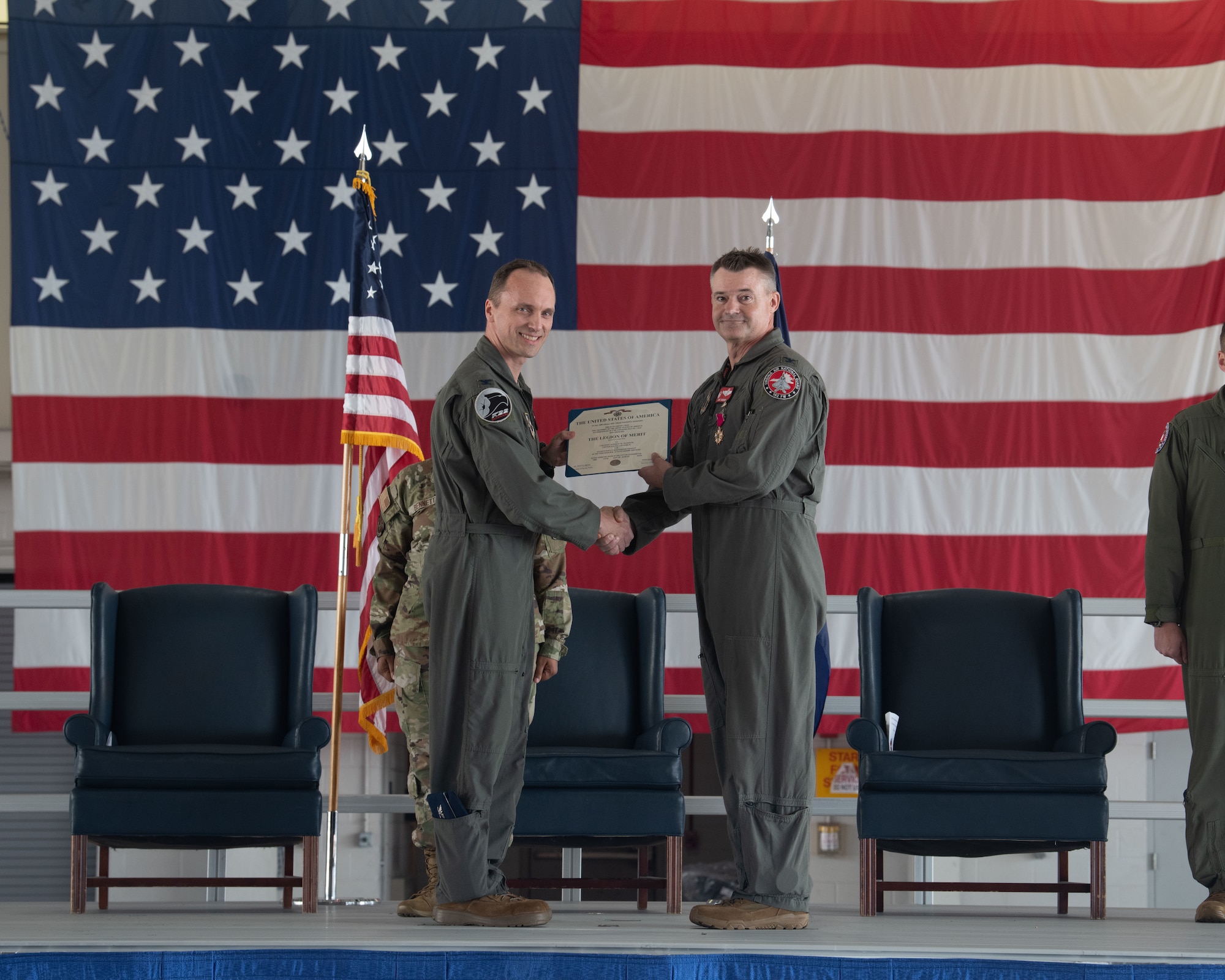 Col. Brock E. Lange, left, 192nd Wing commander, presents the Legion of Merit to Col. Andrew M. Weidner, 192nd Operations Group outgoing commander