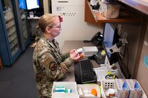 An Airman verifies prescriptions at the pharmacy.