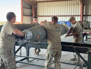 U.S. Air Force Airmen from the 5th Munitions (5MUNS) work on munitions during the 2025 Air Force Combat Operations Competition (AFCOCOMP) at Beale Air Force Base, California, August 12, 2025. AFCOCOMP is an annual competition that tests ammunition Airmen on their speed, efficiency and accuracy for wartime operations.