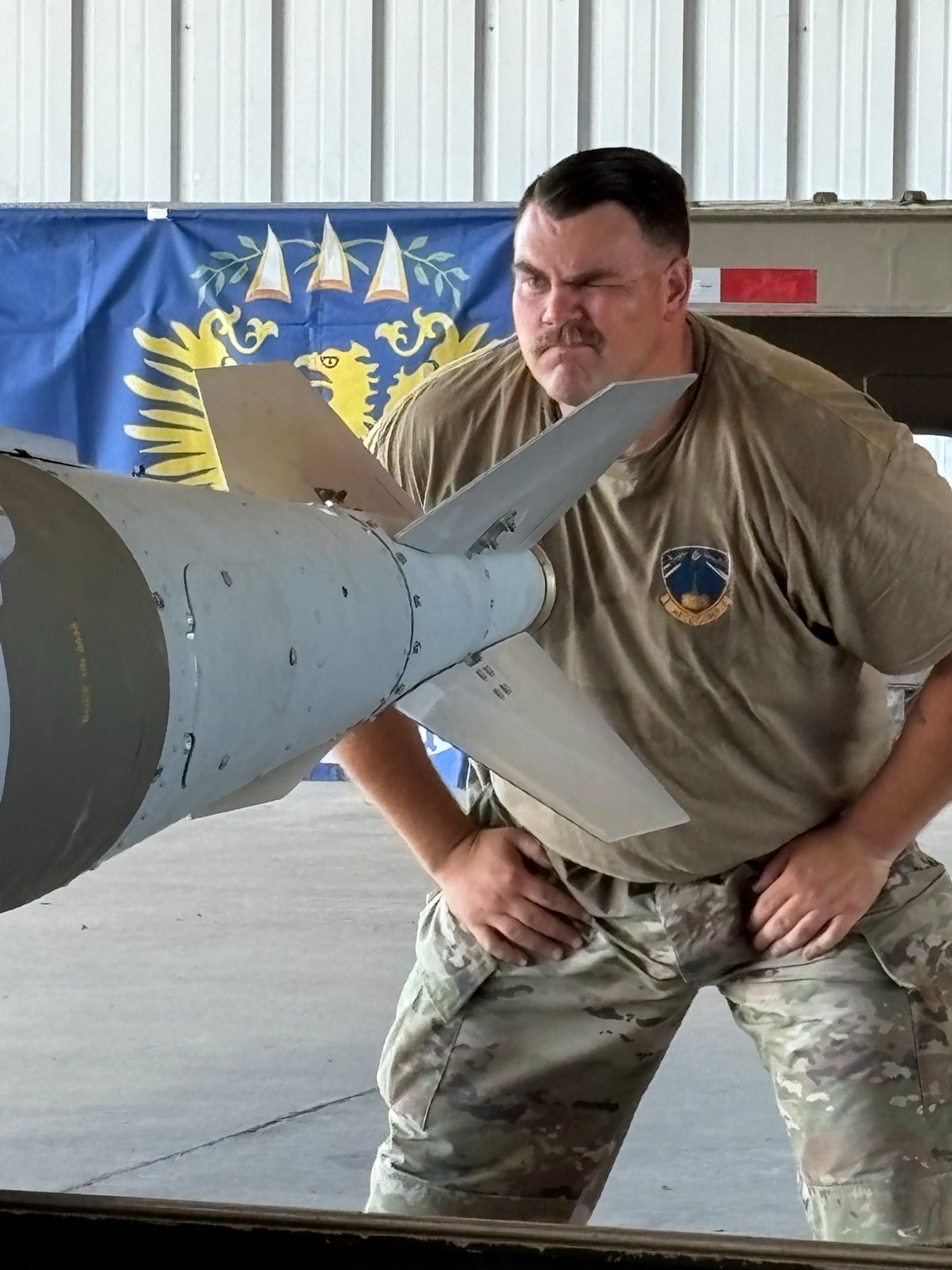 U.S. Air Force Tech. Sgt. Joshua Richardson, 5th Munitions Squadron conventional maintenance section chief, inspects munition during the 2025 Air Force Combat Operations Competition (AFCOCOMP) at Beale Air Force Base, California, August 14, 2025. AFCOCOMP is an annual competition that tests ammunition Airmen on their speed, efficiency and accuracy for wartime operations.