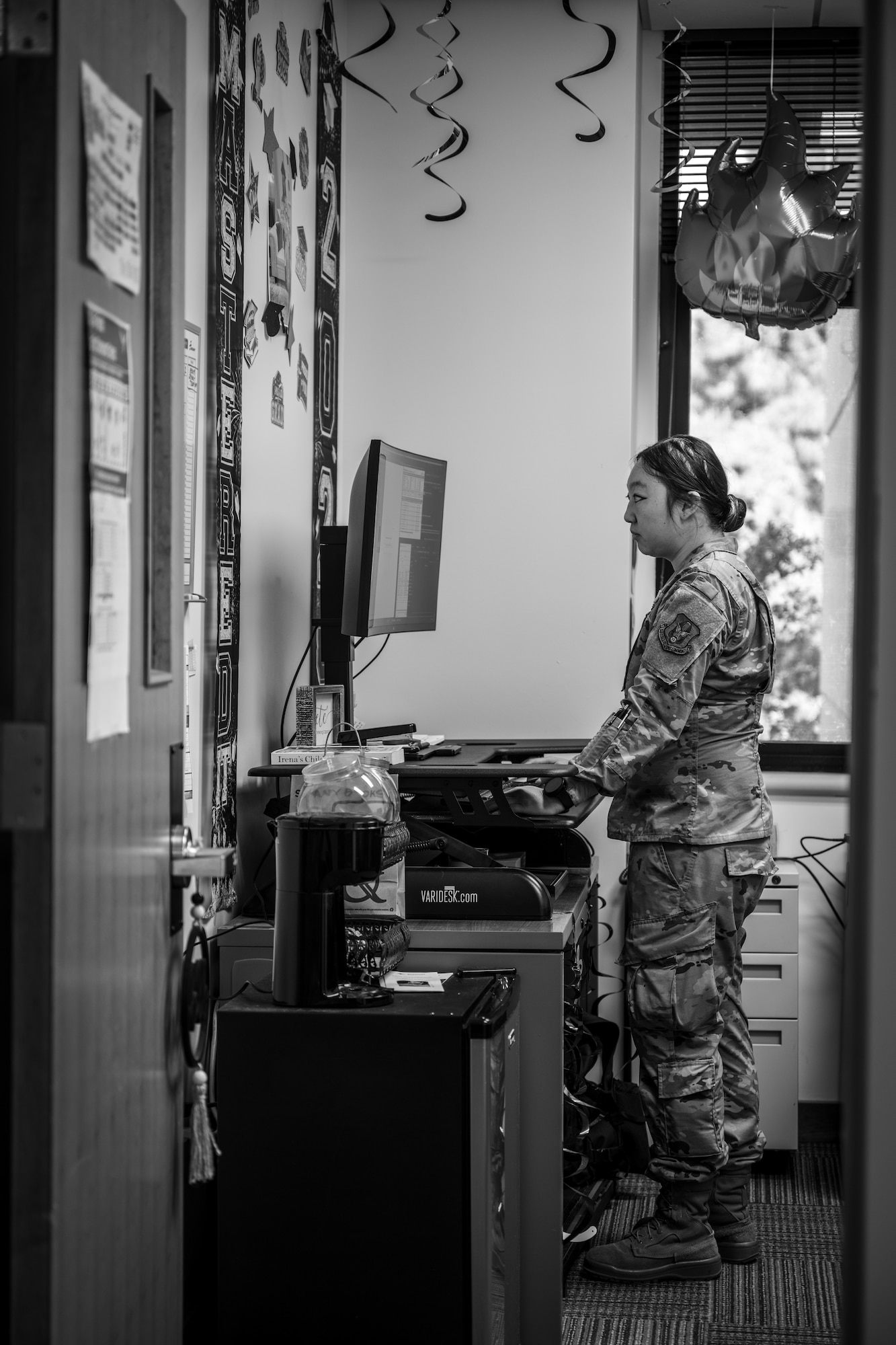 U.S. Air Force Staff Sgt. Michelle Moua, a Squadron Aviation Resource Management (SARM) specialist assigned to the 70th Aerial Refueling Squadron, performs her duties at Travis AFB, Calif., August 20, 2025. In her workspace, Moua is surrounded by celebratory decoration for her Master's education achievement. Moua was recognized with the American Red Cross Service to Armed Forces Award on June 7, 2025 for her volunteer work at David Grant Medical Center. She also recently completed a Master's Degree in Public Health Administration and continues to serve with excellence as a Reserve Airman in the Air Force Reserve.