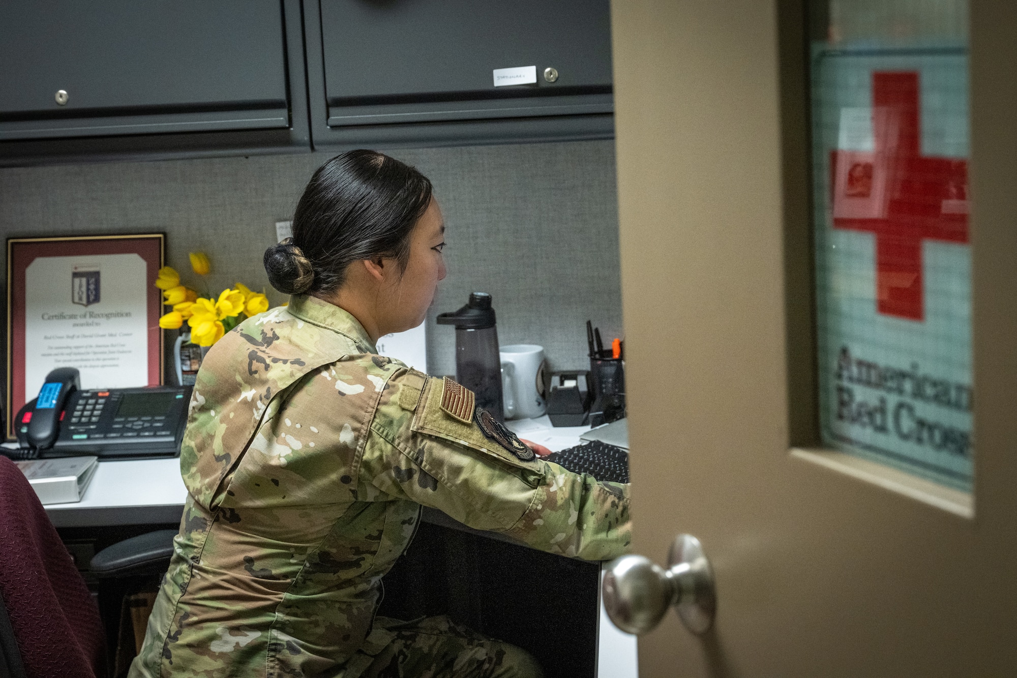 U.S. Air Force Staff Sgt. Michelle Moua, a Squadron Aviation Resource Management specialist assigned to the 70th Aerial Refueling Squadron, manages multiple essential duties while at the Red Cross volunteer office at Travis AFB, Calif., August 20, 2025. Moua was recognized with the American Red Cross Service to Armed Forces Award on June 7, 2025 for her volunteer work at David Grant Medical Center. She also recently completed a Master's Degree in Public Health Administration and continues to serve with excellence as a Reserve Airman in the Air Force Reserve.