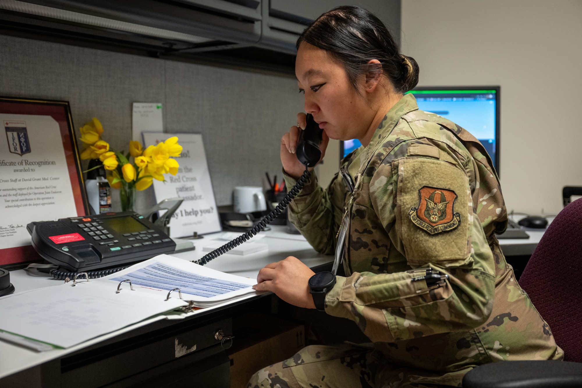 U.S. Air Force Staff Sgt. Michelle Moua, a Squadron Aviation Resource Management specialist assigned to the 70th Aerial Refueling Squadron, coordinates and manages phone calls to help with scheduling for veterans when volunteering for the Red Cross at Travis AFB, Calif., August 20, 2025. Moua was recognized with the American Red Cross Service to Armed Forces Award on June 7, 2025 for her volunteer work at David Grant Medical Center. She also recently completed a Master's Degree in Public Health Administration and continues to serve with excellence as a Reserve Airman in the Air Force Reserve.