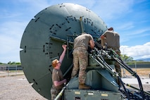 U.S. Space Force Guardians assigned to the 25th Space Range Squadron, Space Delta 11, adjust an antenna outside a Transportable Range Operations Center (TROC) during exercise Resolute Space 2025 in Pearl City, Hawaii, July 24, 2025.