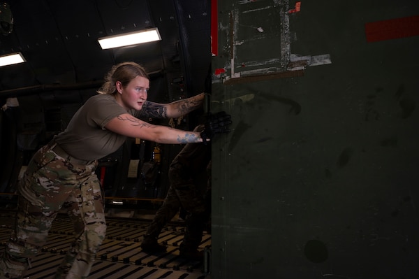 U.S. Air Force Senior Airman Trinity Parker, a loadmaster with the 22nd Airlift Squadron, Travis Air Force Base, California, unloads cargo off a C-5M Super Galaxy aircraft at Andersen Air Force Base, Guam, during the Air Force’s 2025 Department-Level Exercise series, July 14, 2025.