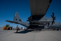 U.S. Airmen assigned to Air Force Special Operations Command onloads cargo onto a U.S. Air Force MC-130J Commando II during Emerald Warrior 25.2 at Marine Corps Air Station, Yuma, July 30, 2025.