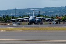 Two U.S Air Force C-5M Super Galaxies are parked in support of the Air Force’s Department-Level Exercise on Joint Base Pearl Harbor-Hickam, Hawaii, July 11, 2025.