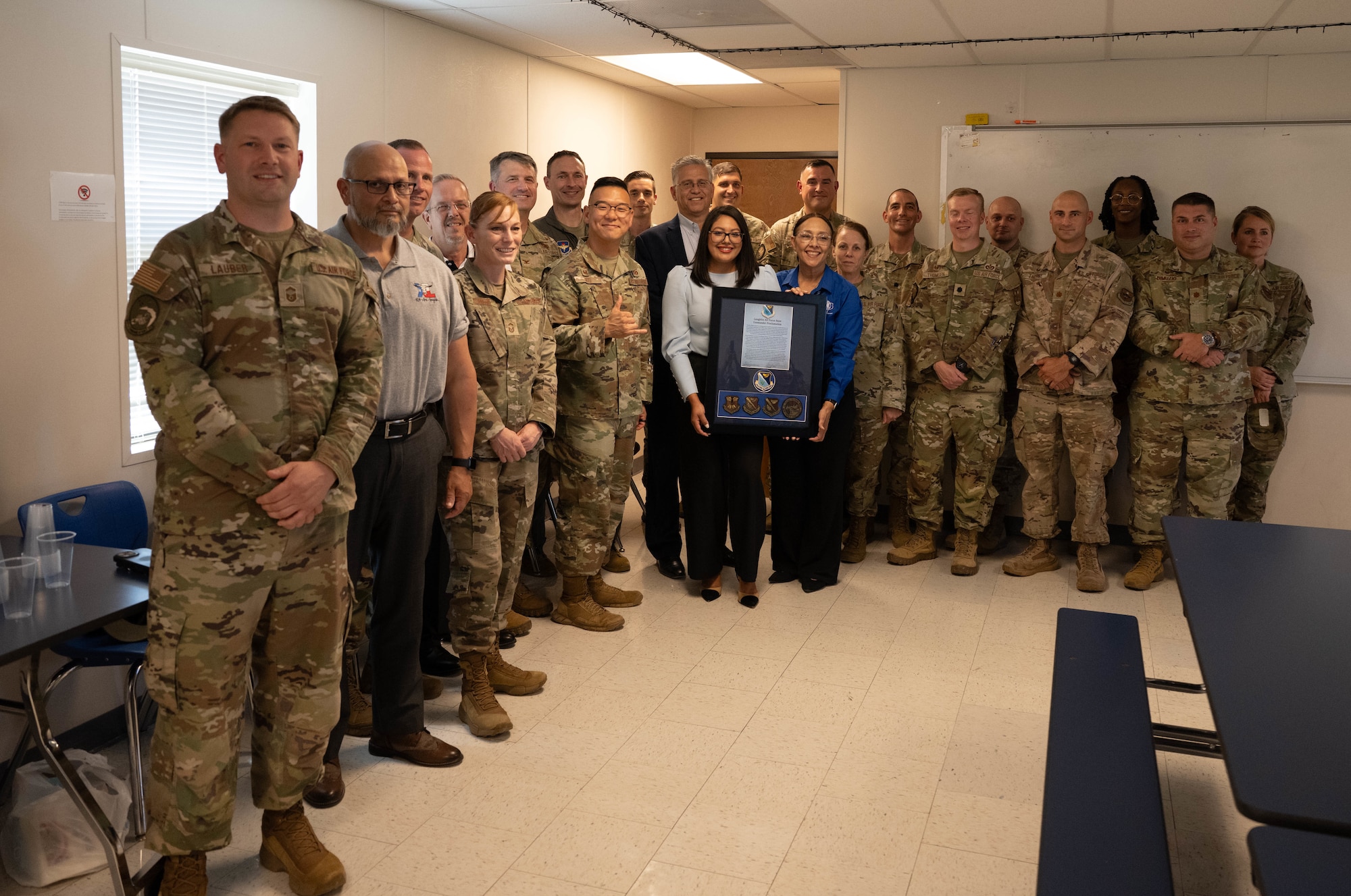 Janette Gomez, Laughlin Air Force Base School Liaison, Aurora Guerra, Roberto ”Bobby” Barrera Elementary STEM Magnet School principle, and 47th Flight Training Wing leadership pose for a group photo at Laughlin AFB, Texas, Aug. 18, 2025.  The 47th FTW gathered to honor RBB in being named a 2025 Blue Ribbon Lighthouse School. (U.S. Air Force photo by Airman 1st Class Darryl Keith)