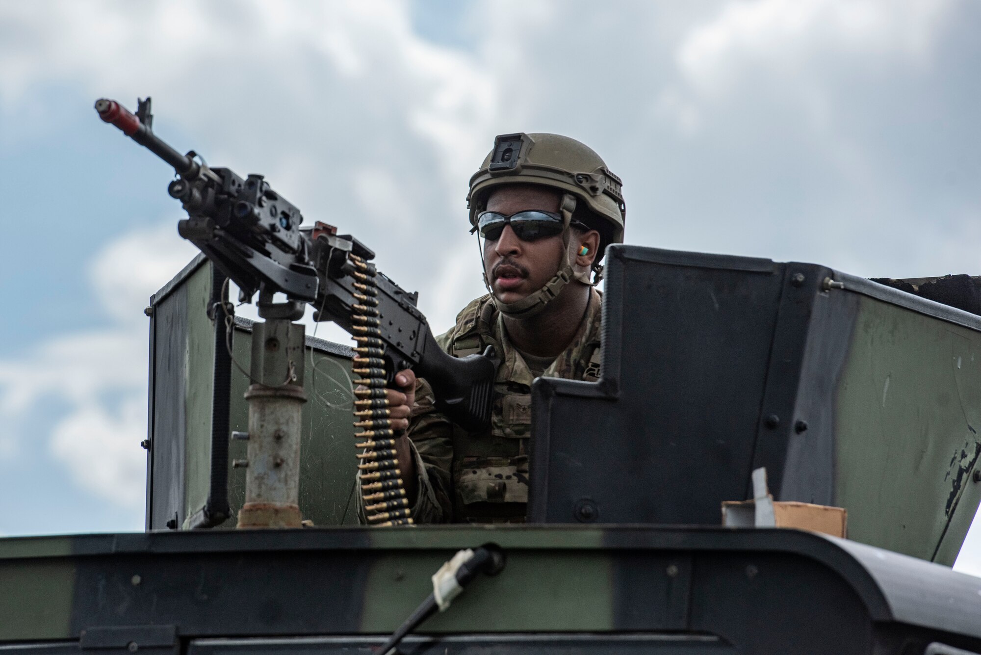 A U.S. Air Force Airman operates a light machine gun
while responding to a simulated ground attack during
Ulchi Freedom Shield 25 at Osan Air Base, Republic
of Korea, Aug. 19, 2025