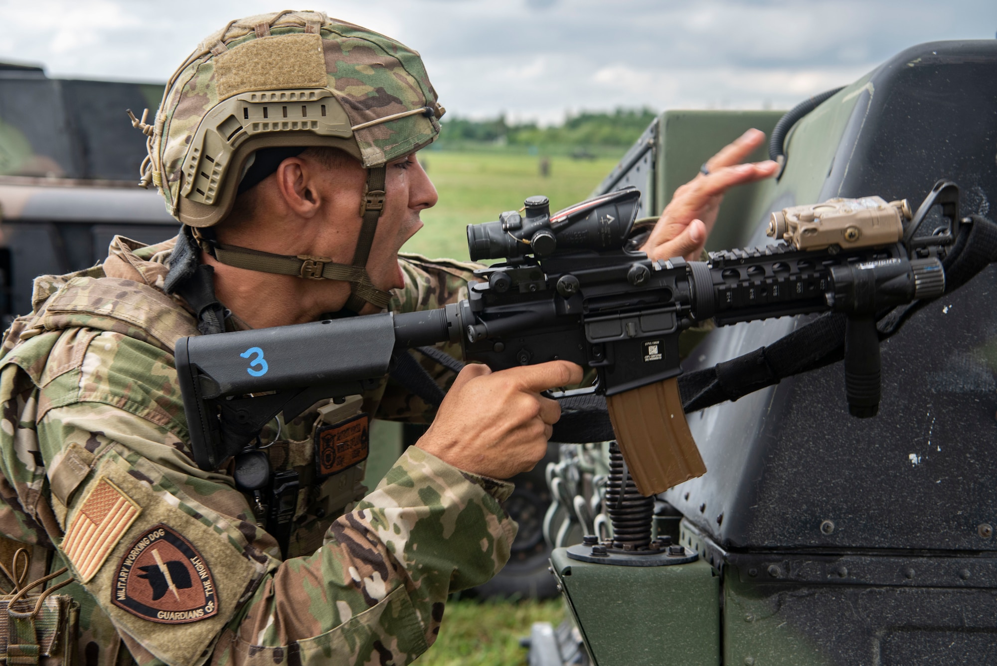 U.S. Air Force Staff Sgt. Dylan White, 51st Security
Forces Squadron military working dog trainer, yells to
the driver of a Humvee to advance while responding to
a simulated ground attack during Ulchi Freedom
Shield 25 at Osan Air Base, Republic of Korea, Aug.
19, 2025