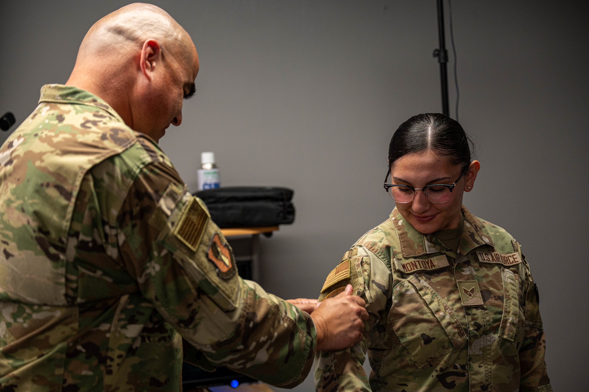U.S. Air Force Senior Airman Marlinda Montoya, right, 35th Security Forces Squadron (SFS) unit training manager, exchanges patches with Chief Master Sgt. David Najera, 35th Fighter Wing command chief, during a Wild Weasel Walk-through at Misawa Air Base, Japan, Aug. 13, 2025.