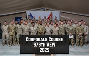 U.S. Marines and Airmen pose for a photo at a Corporals Course graduation ceremony.