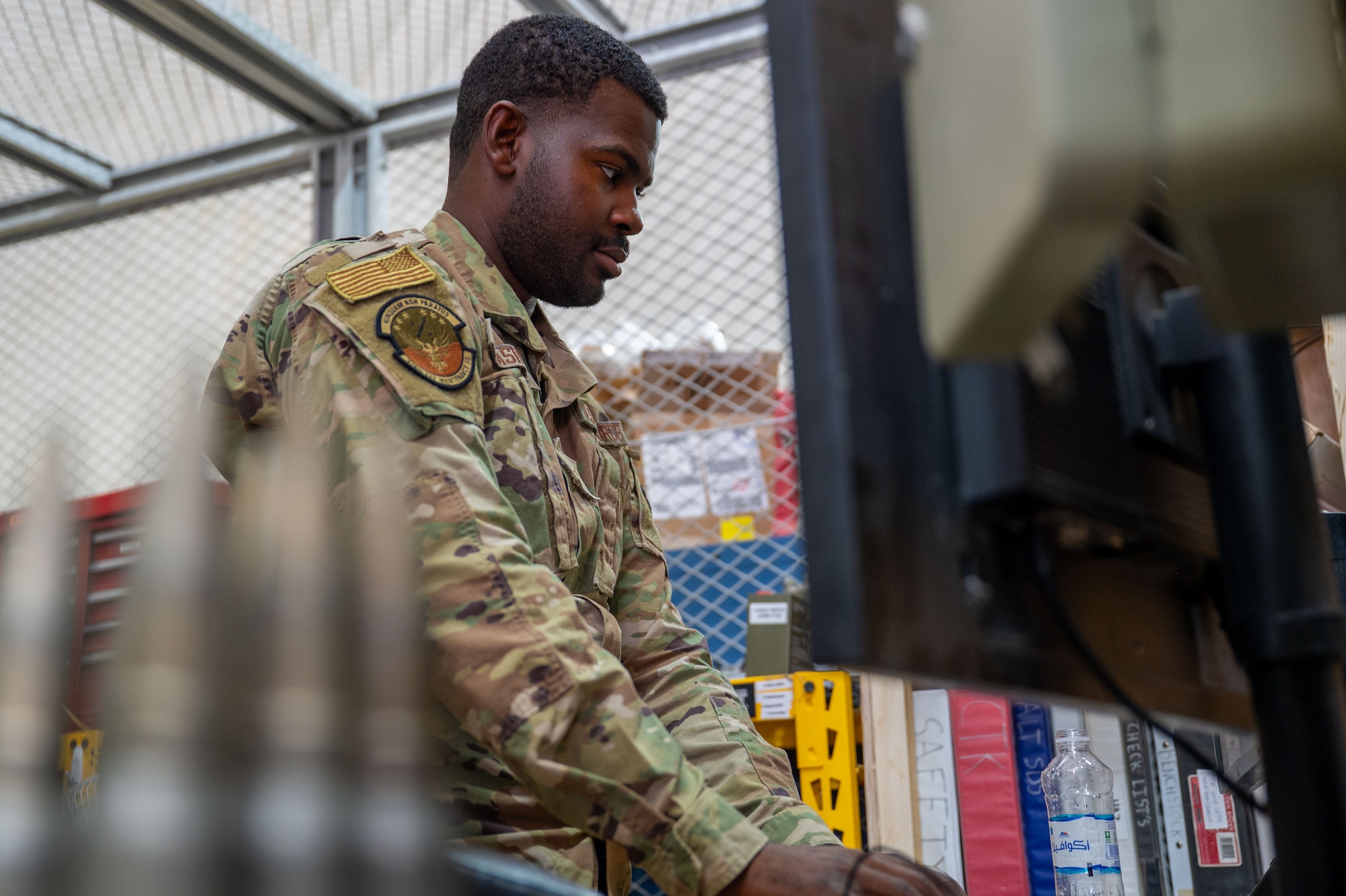 U.S. Air Force Senior Airman Elijah Casimir, 378th Expeditionary Maintenance Squadron support lead, checks a tool accountability log.