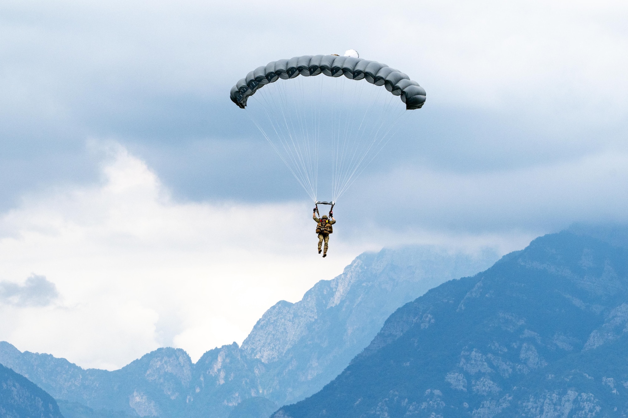Airman landing with parachute