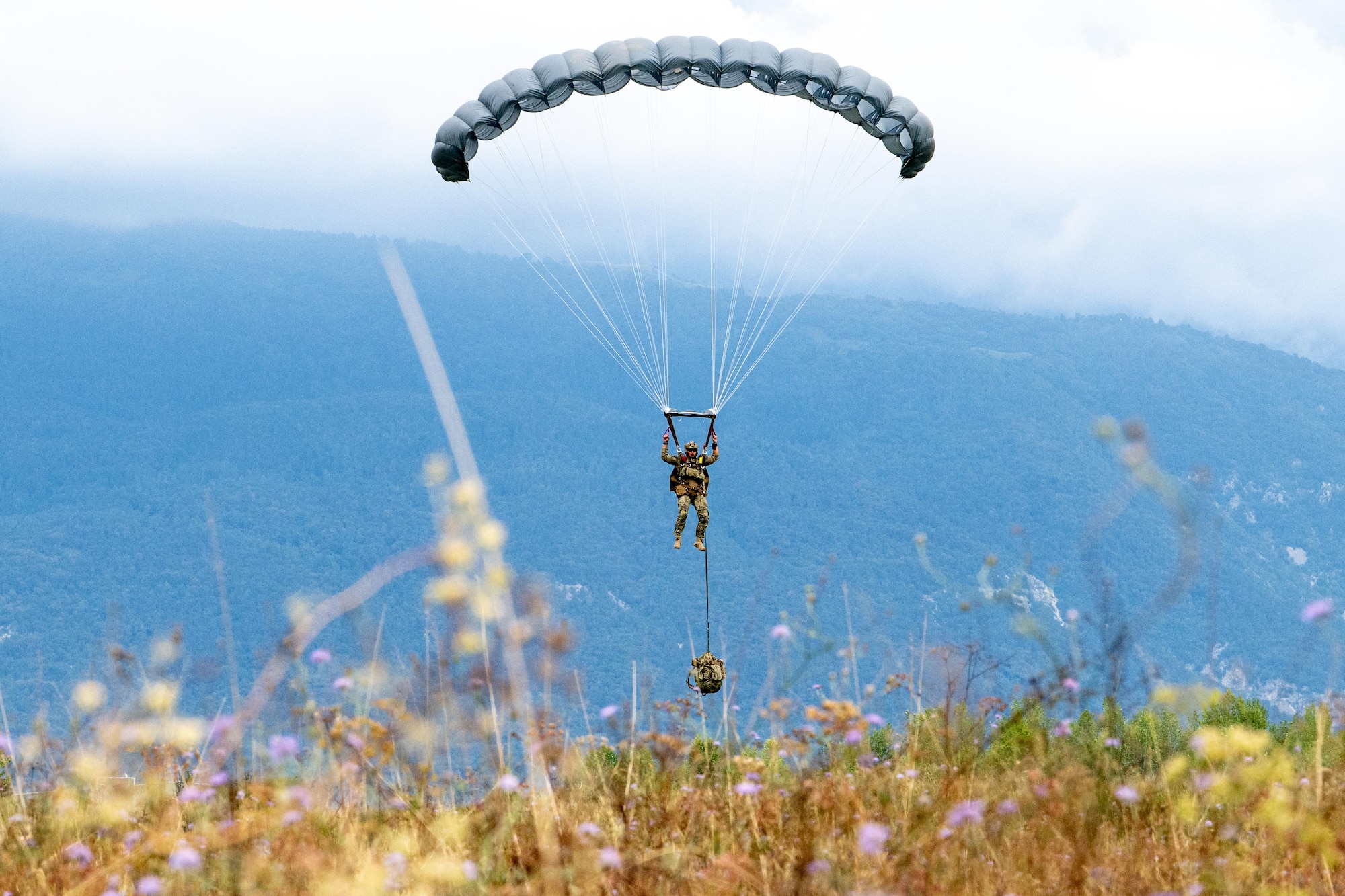 Airman landing with parachute