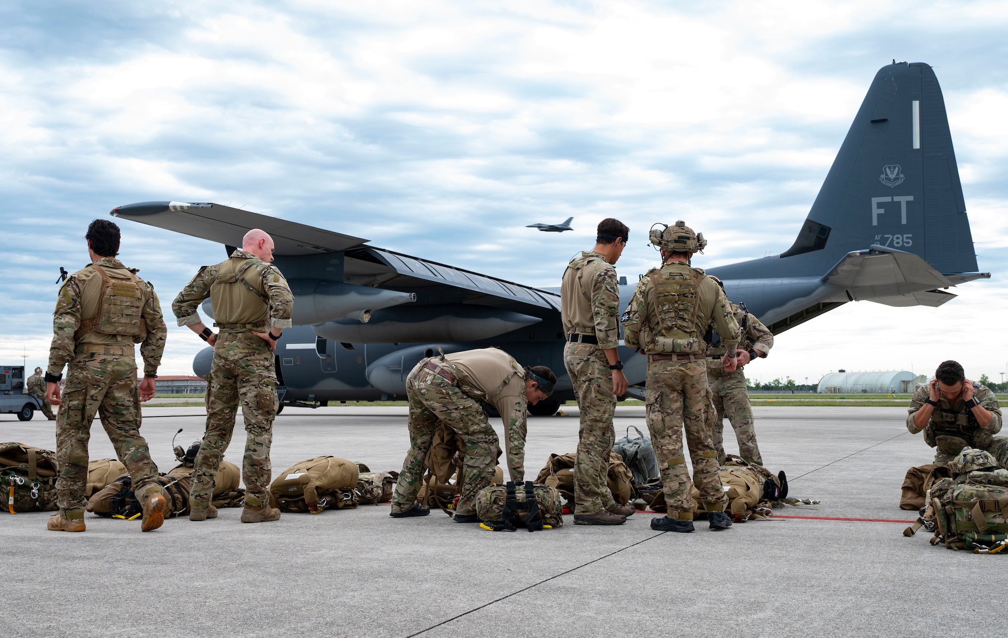 Airmen in front of C-130