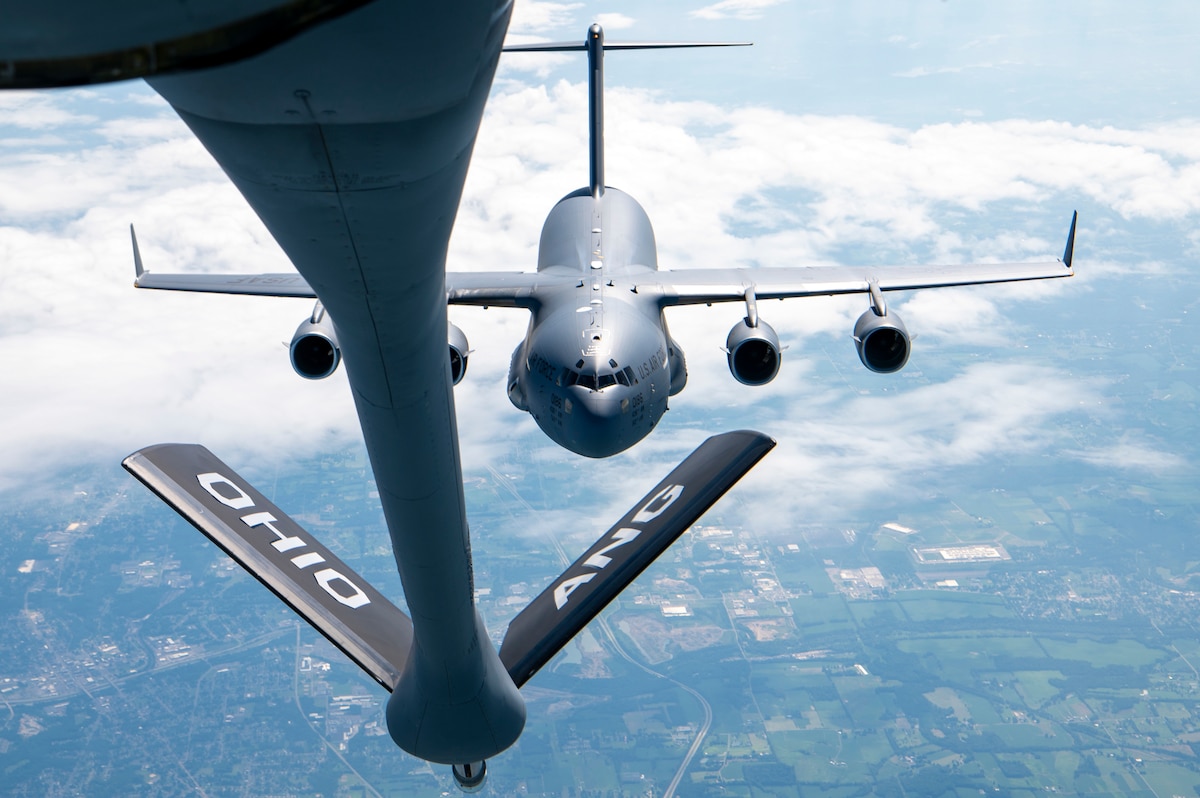 A KC-135 Stratotanker from the 121st Air Refueling Wing prepares to refuel a C-17 Globemaster III from the 436th Airlift Wing over the skies of Pennsylvania, Aug. 6, 2025. The KC-135 enables the 436th Airlift Wing mission of safely flying aircraft, preparing and deploying people, moving cargo and returning America’s fallen heroes with dignity, honor and respect. (U.S. Air National Guard photo by Airman Taylor Warehime)