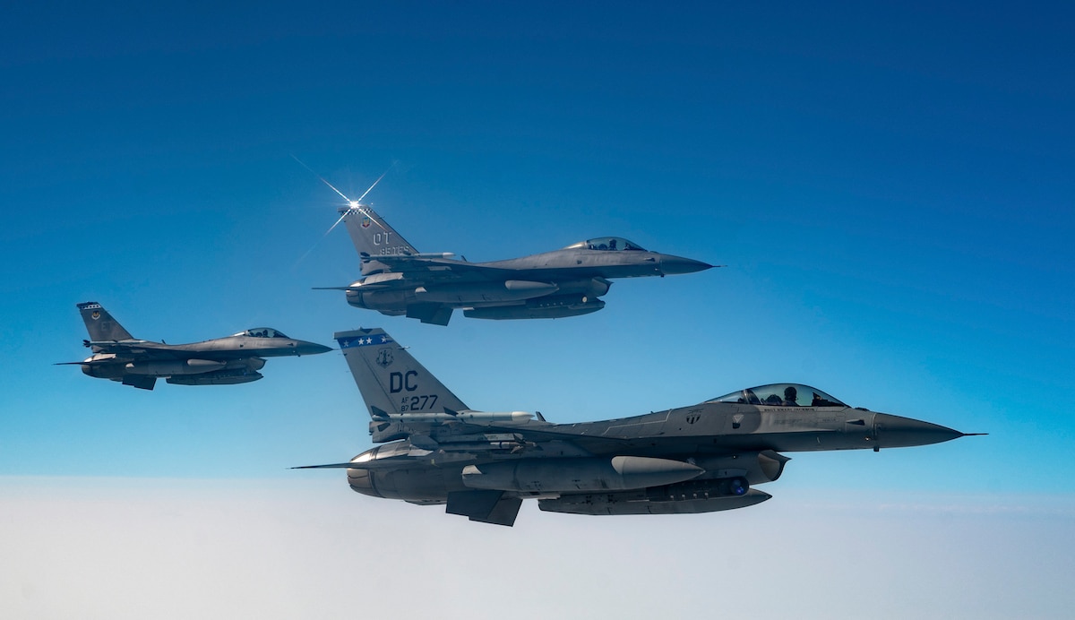 F-16 Fighting Falcons assigned to the 113th Fighter Wing, 85th Test and Evaluation Squadron, and 96th Test Wing fly in formation during exercise Bamboo Eagle 25-3 off the coast of California, Aug. 7, 2025. This iteration of Bamboo Eagle builds on previous exercises, offering a complex and realistic training environment designed to prepare U.S. Air Forces, as part of the joint force, for the evolving challenges of modern warfare. (U.S. Air Force photo by Staff Sgt. Tryphena Mayhugh)