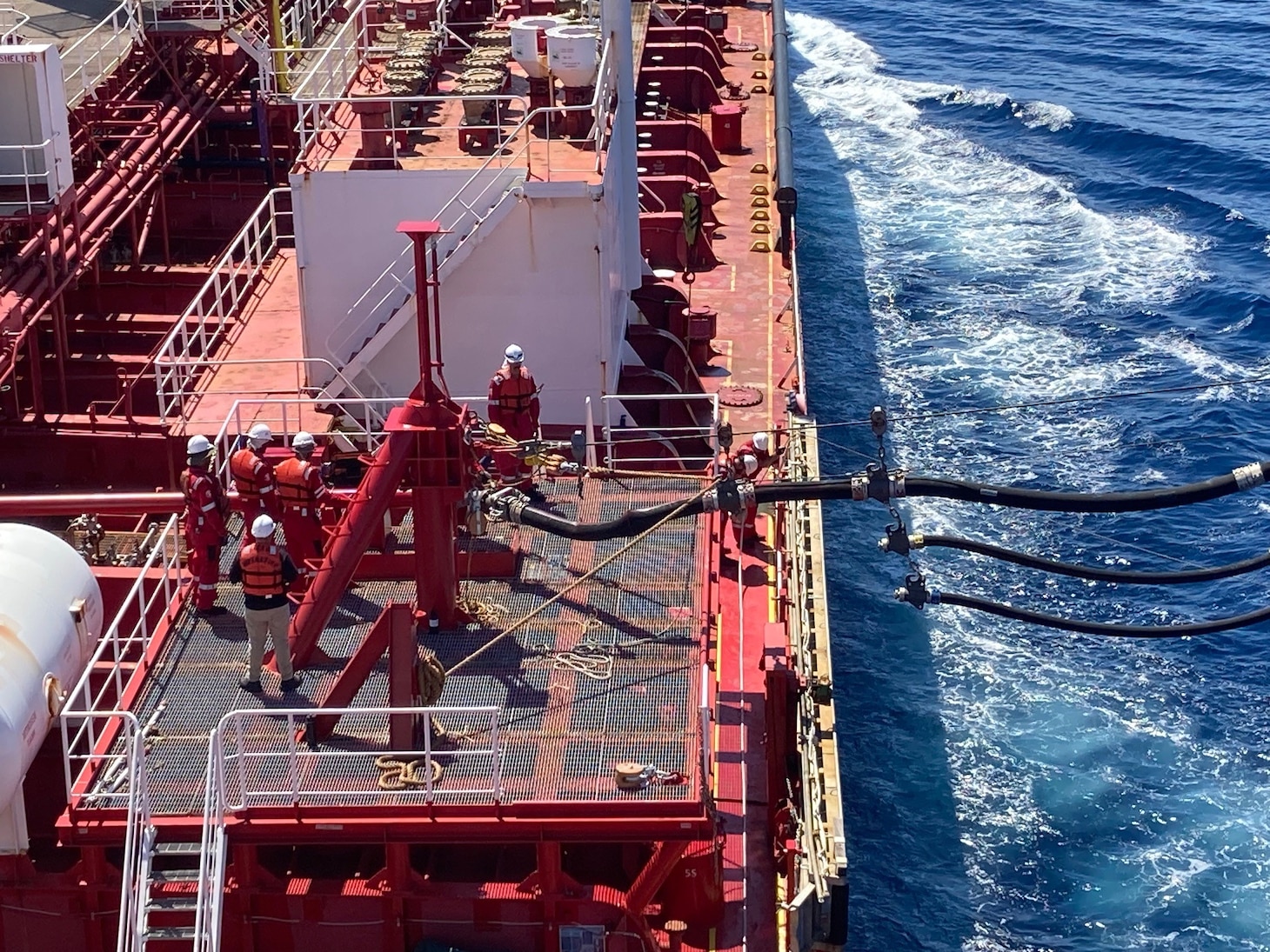 Military Sealift Command’s commercial charter motor tanker Stena Imperative disconnects fuel lines from Japan Maritime Self-Defense Force Mashū-class replenishment ship JS Ōmi (AOE-426) during a consolidated cargo replenishment at sea west of Kyushu, Japan, Aug. 15, 2025.