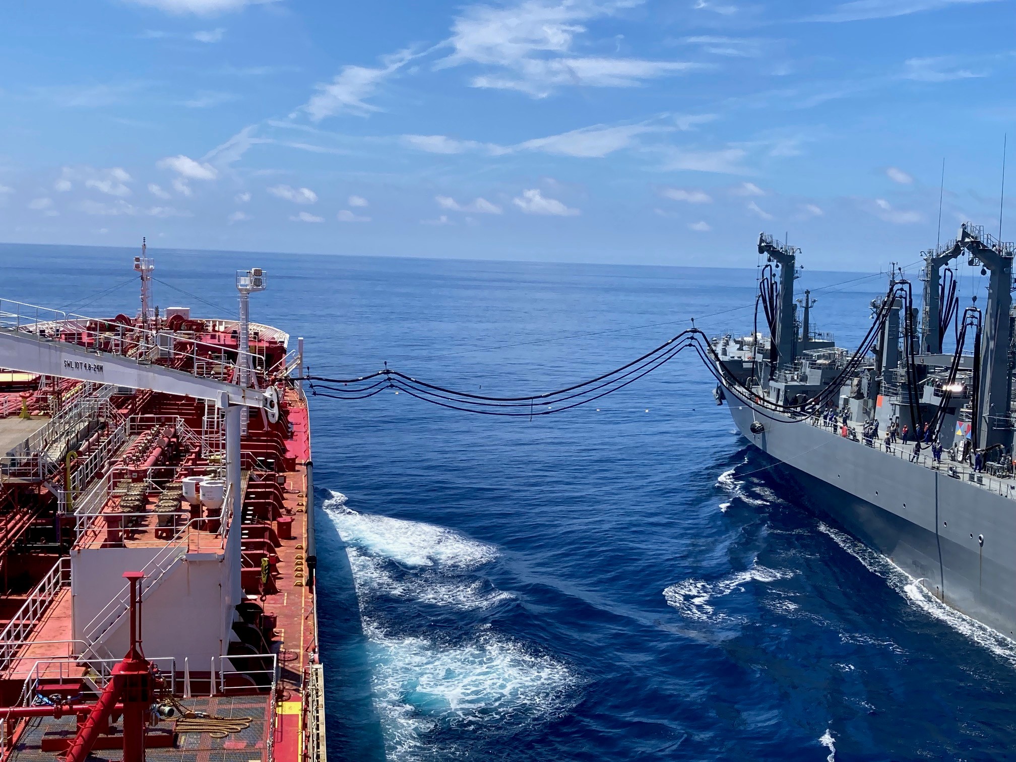 Japan Maritime Self-Defense Force Mashū-class replenishment ship JS Ōmi (AOE-426) connects to Military Sealift Command’s commercial charter motor tanker Stena Imperative during a consolidated cargo replenishment at sea west of Kyushu, Japan, Aug. 15, 2025.