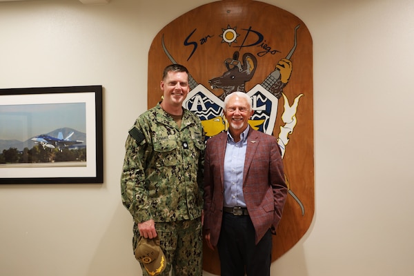 Cmdr. Daniel Hammer, oral maxillofacial surgeon, and U.S. Rep. Jack Bergman (MI-01) pose for a picture Aug. 11 during a tour of the Defense Health Agency’s regional dental laboratory. Bergman was in San Diego to visit Naval Medical Center San Diego to learn how they support readiness, health care delivery, and the Maxillofacial Restoration Program, which is led by Hammer, an innovative initiative that is transforming dental readiness and patient’s lives. (DOD photo by Regena Kowitz)