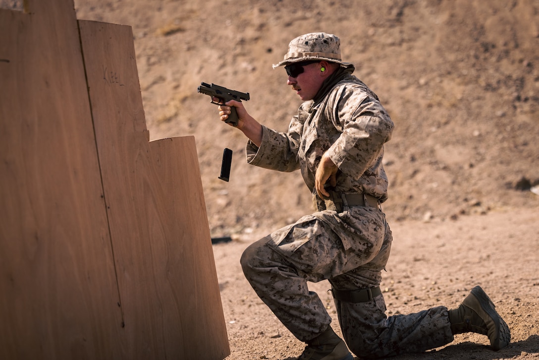 U.S. Marine Corps Lance Cpl. Samuel Templin, a Dalton, Ohio native and military police officer with Charlie Company, 4th Law Enforcement Battalion, Force Headquarters Group, Marine Forces Reserve, reloads while conducting pistol drills on Camp Titin, Jordan, May 18, 2024. Jordan is one of U.S. Central Command’s strongest and most reliable partners in the Levant sub-region. (U.S. Marine Corps photo by Lance Cpl. Joaquin Dela Torre)