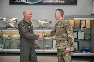Arnold Engineering Development Complex Commander Col. Grant Mizell, right, greets Chief Master Sgt. Evan McCoy during McCoy’s April 17, 2025, visit to Arnold Air Force Base, Tenn., headquarters of AEDC. McCoy officially assumed the role of AEDC Senior Enlisted Leader on Aug. 1, 2025. (U.S. Air Force photo by Keith Thornburgh)