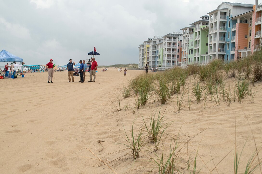 U.S. Army Corps of Engineers, Norfolk District project managers Victor Roberts and Ryan Frye, and hydraulics and hydrology engineer Ellen Cava, join City of Virginia Beach officials James White, program manager, and Ryan Firenze, Sandbridge renourishment project manager, to assess conditions at Sandbridge Beach in Virginia Beach on Aug. 19, 2025. The team conducted prestorm inspections across multiple beaches ahead of Hurricane Erin's projected impacts. (U.S. Army photo by Alysia Rigano)