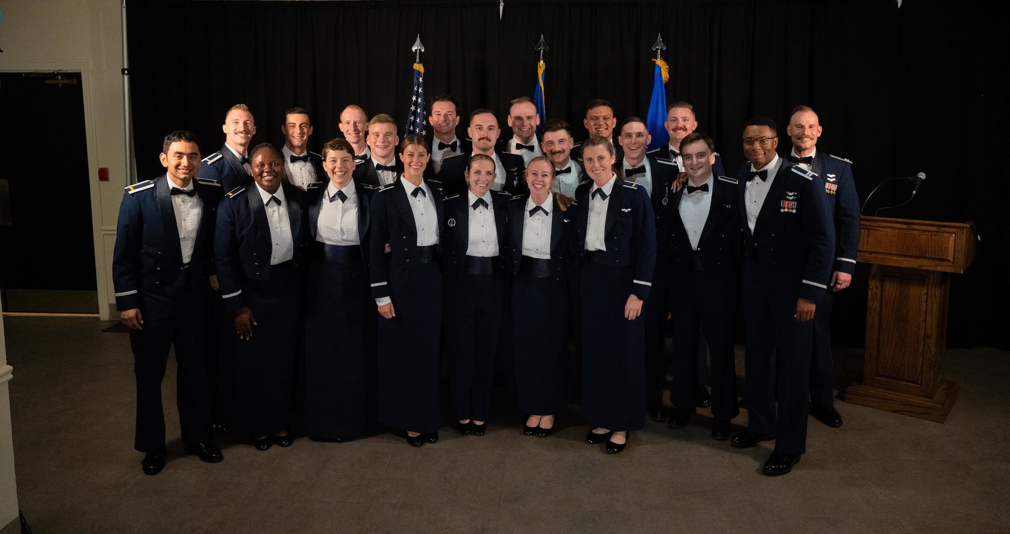 U.S. Air Force Airmen from graduating Class 25-14 pose for a photo at Laughlin Air Force Base, Texas, Aug. 21, 2025. Twenty-one U.S. Air Force officers were awarded silver wings during the ceremony, symbolizing their completion of the Undergraduate Pilot Training program. (U.S. Air Force photo by Airman 1st Class Harrison Sullivan)