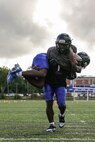 A Randolph High School football player carries his teammate during a Marine Corps combat fitness test hosted by Marines with Marine Corps Recruiting Command during Marine Week Boston, Aug. 21, 2025. During Marine Week Boston, Marines with Marine Corps Recruiting Command shared Marine Corps traditions with local high schools in honor of the Corps’ 250th birthday. Marines stationed across the globe commemorate the 250th anniversary of the Marine Corps, honoring a distinguished legacy of service, sacrifice, and unwavering fidelity to both the nation and fellow Marines. (U.S. Marine Corps photo by Sgt. Aidan Hekker)
