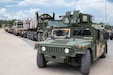 In a combined effort, units from the 103rd and 310th ESC work together to move to the field portion, 