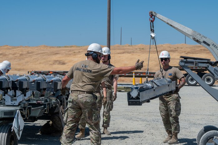 U.S. Air Force Airmen assigned to the 48th Munitions Squadron participate in Operation Tropic Twister as part of the Air Force Combat Operations Competition (AFCOCOMP) at Beale Air Force Base, California, Aug. 14, 2025.