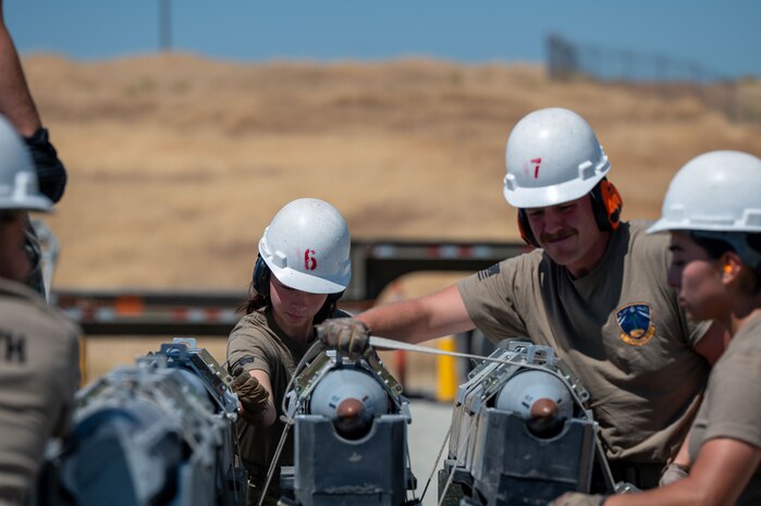 U.S. Air Force Airmen assigned to the 48th Munitions Squadron, participate in Operation Tropic Twister as part of the Air Force Combat Operations Competition (AFCOCOMP) at Beale Air Force Base, California, Aug. 14, 2025.